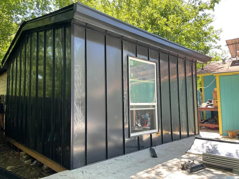 Black standing seam metal wall panels for Roof Inspection in Kirby